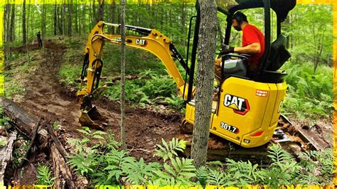 building trailes with a mini excavator|kubota mini excavator trail making.